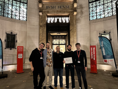 A picture of five of the authors of the Distinguished Paper Award in front of Bush House. From the left: Fabio Pierazzi (KCL), Feargus Pendlebury (KCL & RHUL), Lorenzo Cavallaro (UCL), Daniel Arp (TU Berlin), and Erwin Quiring (Ruhr Bochum).